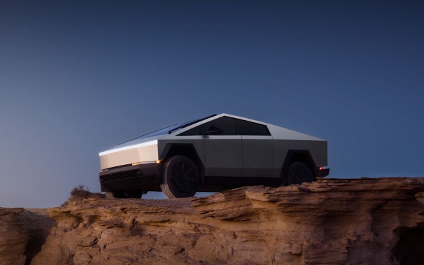 Tesla запустила двухместные беспилотные такси с поднимающимися дверцами